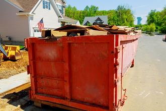 filled construction dumpster